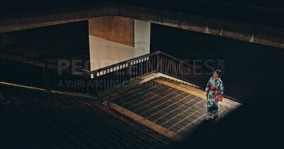 Buy stock photo Japanese woman, kimono and culture on stairs at night, city and religion for heritage by outdoor. Young person, relax or traditional clothes in tokyo in respect, steps or pride in indigenous fashion