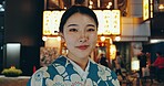 Japanese woman, kimono or culture in portrait at night, city or religion on heritage celebration. Young person, face or traditional clothes in tokyo in beauty, wellness or pride in indigenous fashion