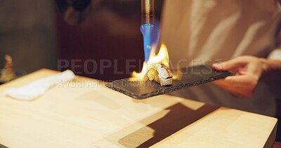 Buy stock photo Hands, fire and cooking sushi with chef in restaurant for traditional Japanese food or cuisine closeup. Kitchen, flame for seafood preparation and person working with gourmet meal recipe ingredients