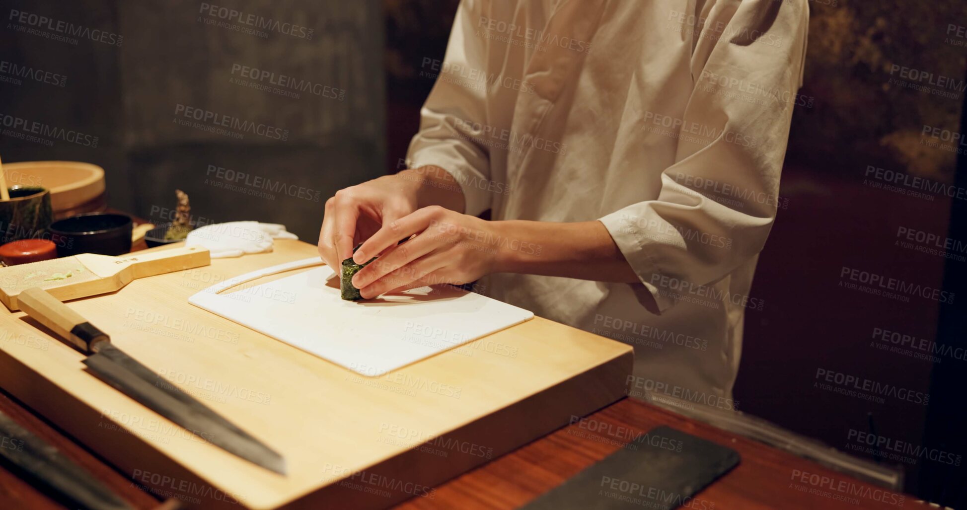 Buy stock photo Hands, recipe and chef cooking sushi in restaurant for traditional Japanese cuisine or dish closeup. Kitchen, table for seafood preparation and person working with gourmet food or meal ingredients