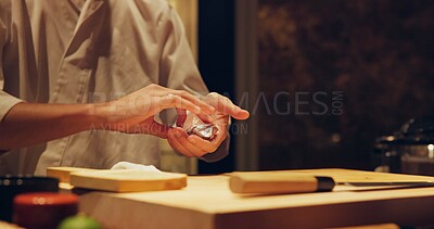 Buy stock photo Hands, recipe and chef cooking sushi in restaurant for traditional Japanese cuisine or dish closeup. Kitchen, ingredients for seafood preparation and person working with gourmet food or meal on table