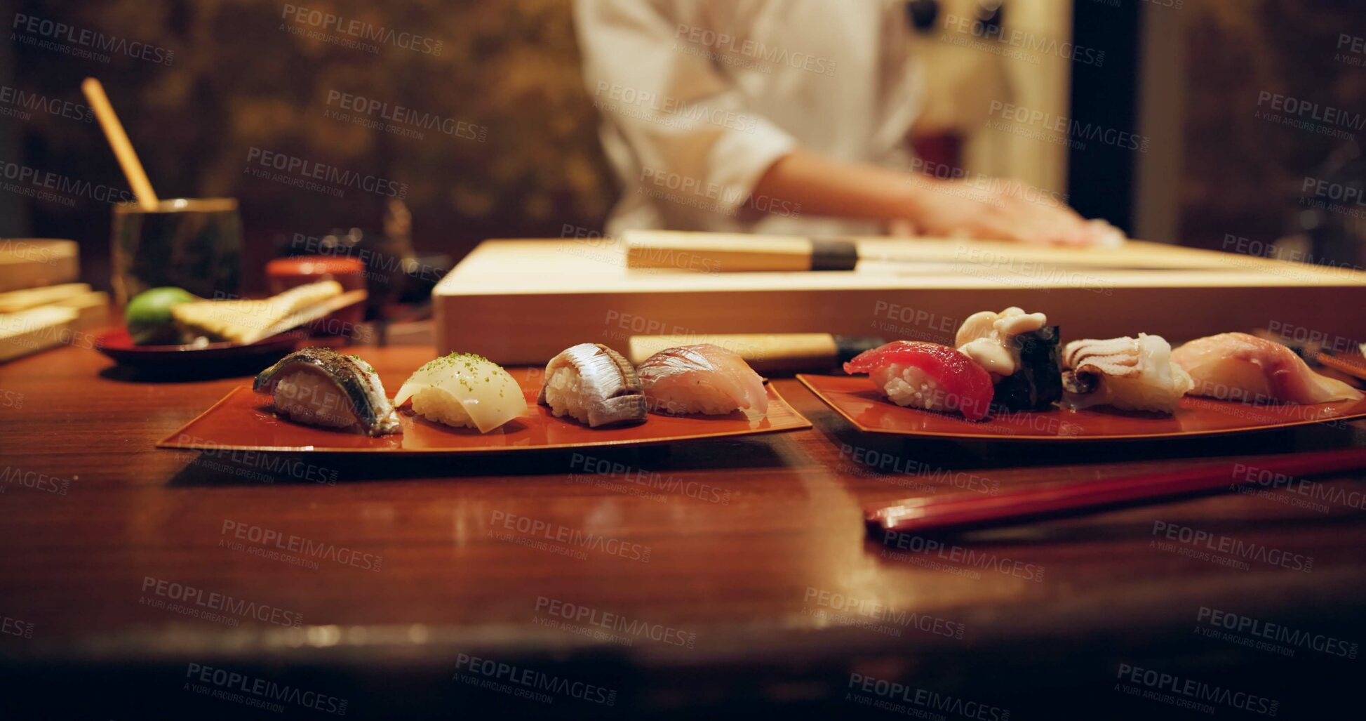 Buy stock photo Sushi, plate and serving with chef in restaurant for luxury cuisine or raw meal preparation closeup. Kitchen, food and presentation with person cooking local Japanese seafood for service in Tokyo