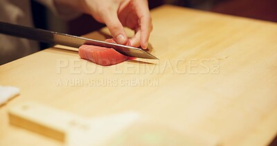 Buy stock photo Hands, food and sushi chef cutting fish in restaurant for traditional Japanese cuisine or dish closeup. Kitchen, cooking on table for seafood preparation and person working with gourmet ingredients