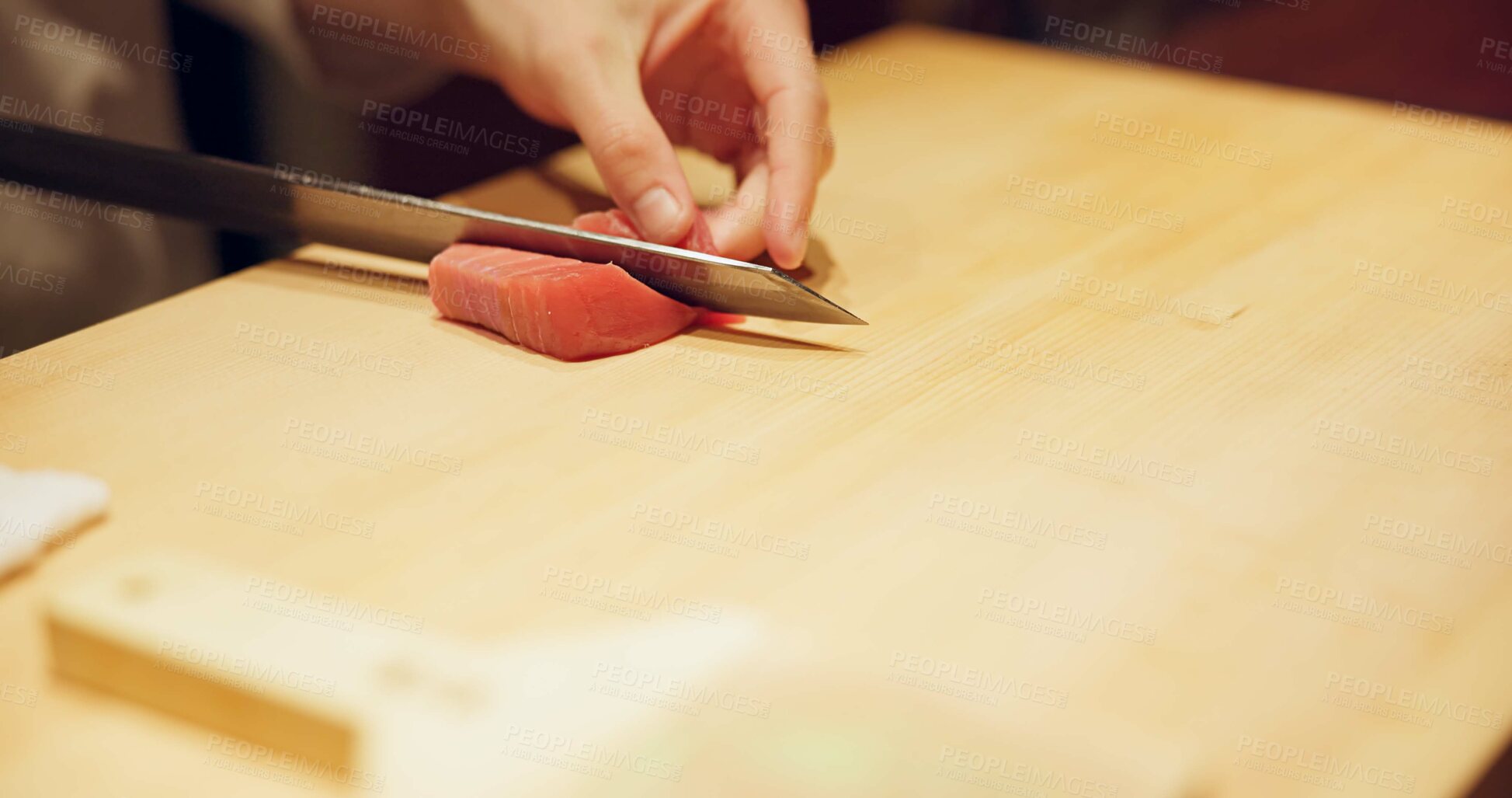 Buy stock photo Hands, food and sushi chef cutting fish in restaurant for traditional Japanese cuisine or dish closeup. Kitchen, cooking on table for seafood preparation and person working with gourmet ingredients