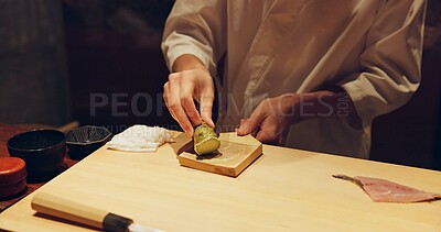 Buy stock photo Hands, cooking and wasabi with sushi chef in restaurant for traditional Japanese cuisine or dish closeup. Kitchen, salmon roll or seafood preparation and person working with gourmet meal ingredients