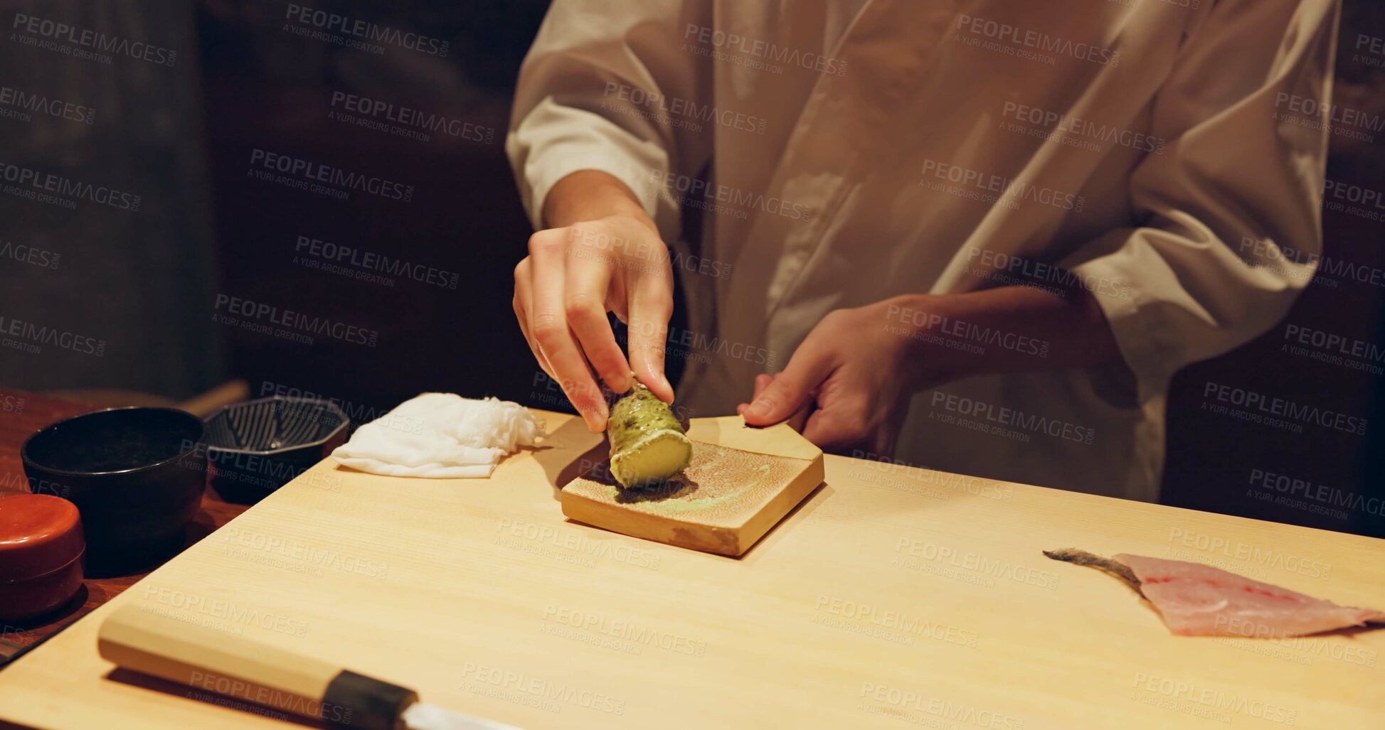 Buy stock photo Hands, cooking and wasabi with sushi chef in restaurant for traditional Japanese cuisine or dish closeup. Kitchen, salmon roll or seafood preparation and person working with gourmet meal ingredients