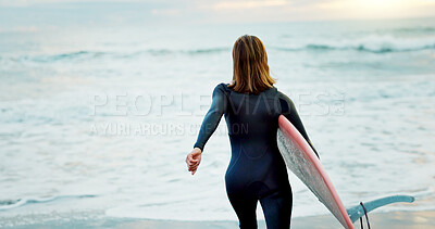 Surfing, beach and woman with surfboard running for water sports, fitness and freedom by ocean. Nature, travel and back of person on holiday, vacation and adventure by sea for hobby, fun and coast