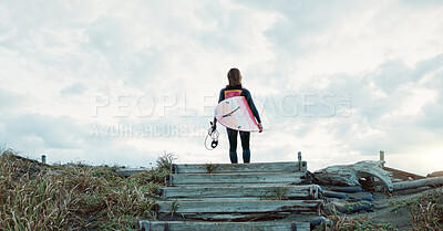 Buy stock photo Surfing, beach and woman on stairs with surfboard for water sports, fitness and freedom by ocean. Nature, travel and back of person for wellness on holiday, vacation and adventure by tropical sea