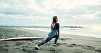 Surfer, woman stretching at beach and fitness for extreme sports with ocean view, waves and travel. Flexibility, warm up and exercise outdoor, surf and nature with surfboard and athlete on adventure