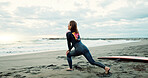 Surfer, woman stretching at beach and back, fitness for extreme sports with ocean, waves and travel. Flexibility, warm up and exercise outdoor, surf and nature with surfboard and athlete on adventure