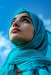 Muslim, portrait and woman wearing a traditional scarf or hijab for beauty fashion, modesty, and Islam. Confident, vibrant and beautiful shot of girl with colorful textile for awareness and hope