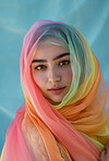 Muslim, portrait and woman wearing a traditional scarf or hijab for beauty fashion, modesty, and Islam. Confident, vibrant and beautiful shot of girl with colorful textile for awareness and hope