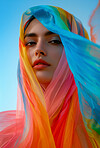 Muslim, portrait and woman wearing a traditional scarf or hijab for beauty fashion, modesty, and Islam. Confident, vibrant and beautiful shot of girl with colorful textile for awareness and hope