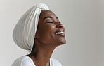 African, portrait and woman wearing a traditional head wrap for beauty fashion, modesty, and tradition. Confident, smile and beautiful shot of a happy girl for contentment, skincare or hygiene