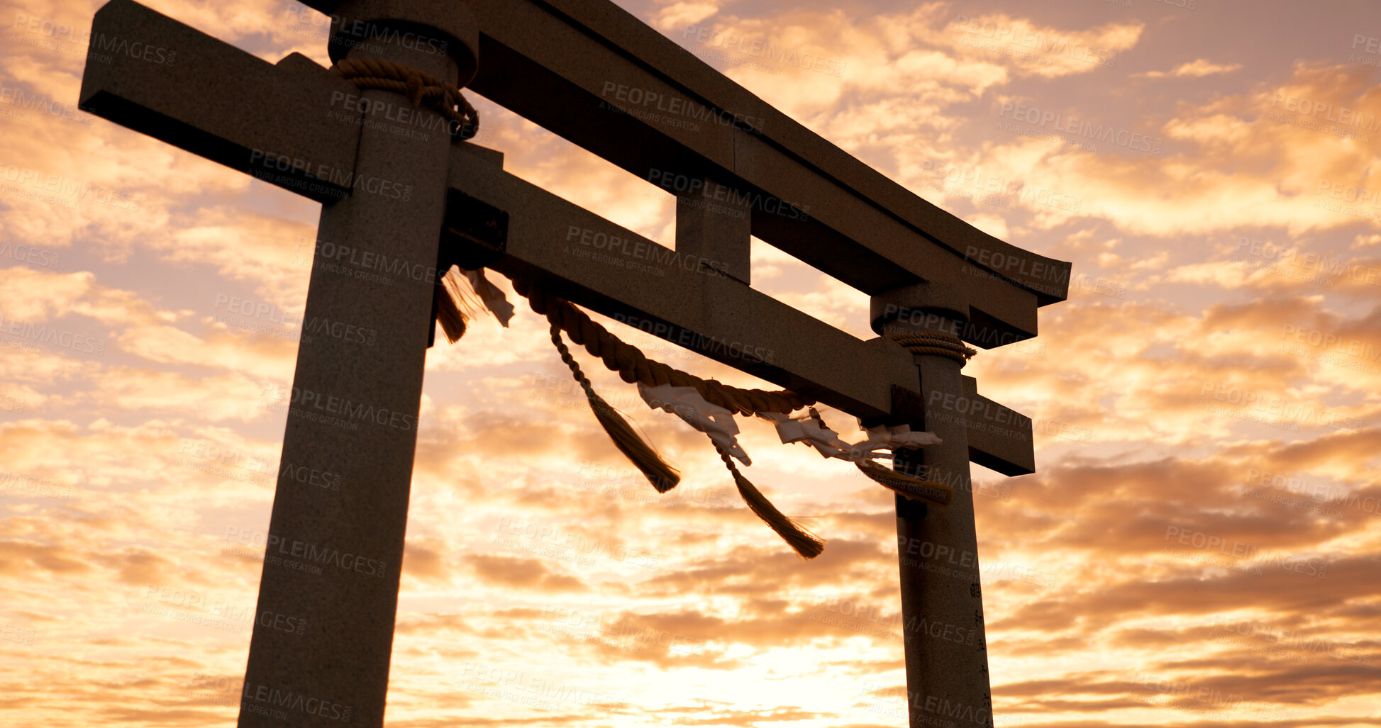 Buy stock photo Torii gate, sunset and cloudy sky with zen, peace and spiritual history on travel adventure in Japan. Shinto architecture, Asian culture and calm nature on Japanese landscape with sacred monument.