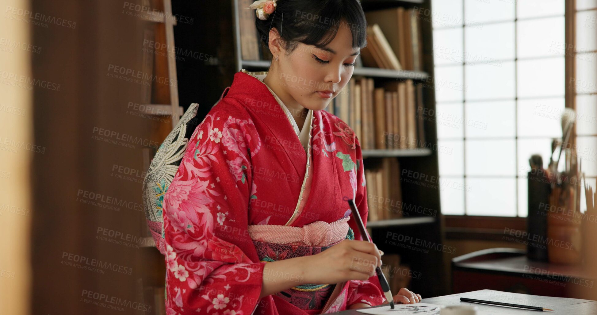 Buy stock photo Calligraphy, writing and traditional Japanese woman in home for script, paper and documents. Creative, Asian culture and person with vintage paintbrush, ink and tools for art, font and text in house