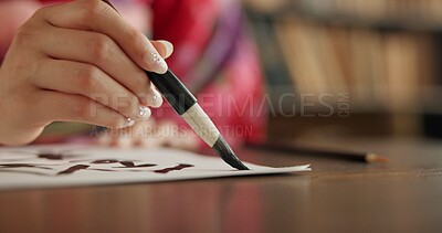 Buy stock photo Ink, Japanese writing and person in traditional home for script, documents and paper on desk. Creative, Asian culture and hands with vintage paintbrush tools for calligraphy, font and text in house