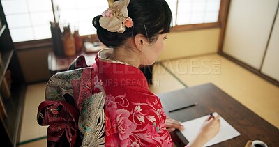 Buy stock photo Traditional, writing and Japanese woman in home with paper, documents and script at desk. Creative, Asian culture and person with paintbrush, ink and tools for calligraphy, font and text in house