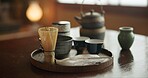 Tea cup, ceremony and Japanese tradition with matcha and green brew for healing and detox practise. Temae, pot and cut for an indigenous, nutrition and wellness hot drink in a home with healthy herbs