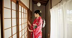 Japan, woman and kimono in corridor for tradition, tea ceremony and hallway of Chashitsu room or door. Entrance, person and vintage dress or fashion for temae, ritual and waiting for hospitality