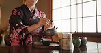 Japanese, woman and matcha for tea ceremony in Chashitsu room with kimono dress and traditional custom. Person, temae and vintage style outfit for culture, fashion and honor with antique crockery 