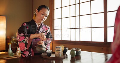 Buy stock photo Traditional, culture and Japanese woman with tea in home with herbs, leaves and flavor in teapot. Kimono, indigenous and person with matcha beverage for ceremony, ritual and wellness for drinking