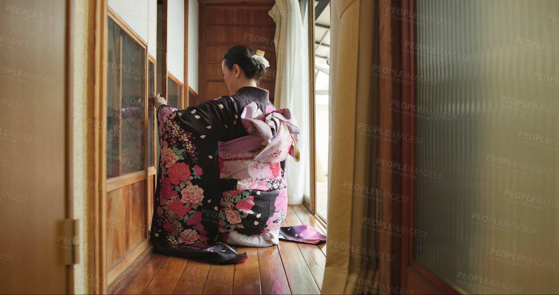 Buy stock photo Open door, Japanese woman and culture with kimono, respect and relax in traditional accommodation. Morning, home and kneel at a window with zen, calm and ancient architecture with antique dress