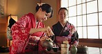 Japanese, friends or kimono for tea ceremony in Chashitsu room with peace or custom tradition. Women, temae or vintage style dress or conversation with culture, fashion or honor with antique crockery