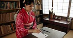 Ink, writing and Japanese woman in home for traditional script on paper, documents and page. Creative, Asian culture and person with vintage paintbrush tools for calligraphy, font and text in house