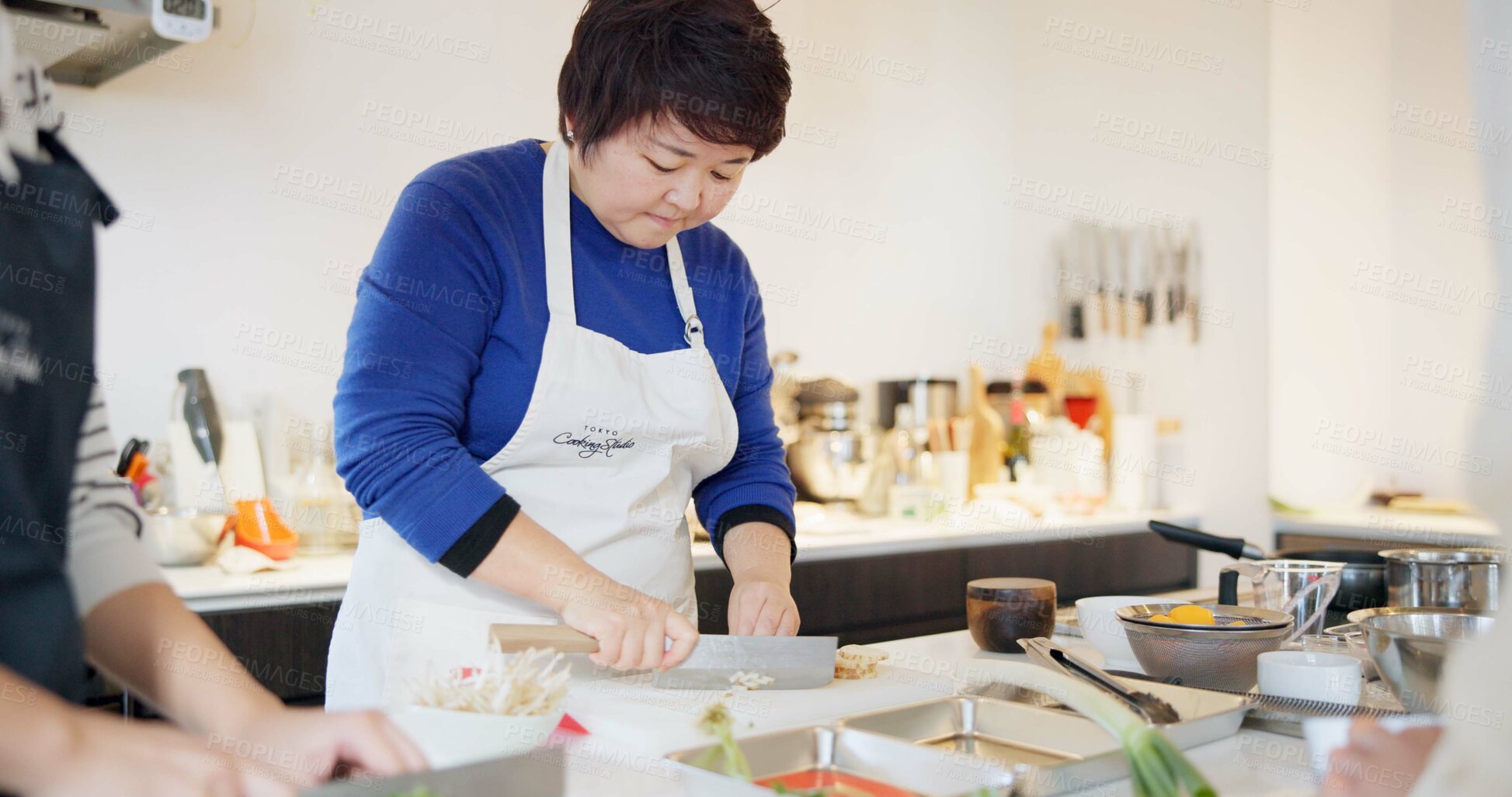 Buy stock photo Japanese chef, woman and kitchen with knife, cooking and prepare ingredients for catering services. Person, food and chopping board for nutrition, diet or health with job in restaurant, cafe or diner