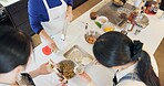 Japan, women and chef in kitchen with preparation for food, Japanese cuisine and healthy meal in restaurant. Cooking, people and traditional lunch with top view or dumplings for dinner and culture