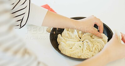 Buy stock photo Japan, hands and dumplings on table for dinner, brunch and traditional meal in restaurant or cafe. Culture, gyozo and asian cuisine for nutrition, healthy diet and lunch with preparation or pastry