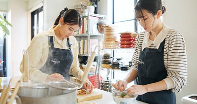 Buy stock photo Cooking class, restaurant and women with Japanese food in a kitchen with chef and learning professional skill. Student, education and Asian cuisine course with people together working on skills