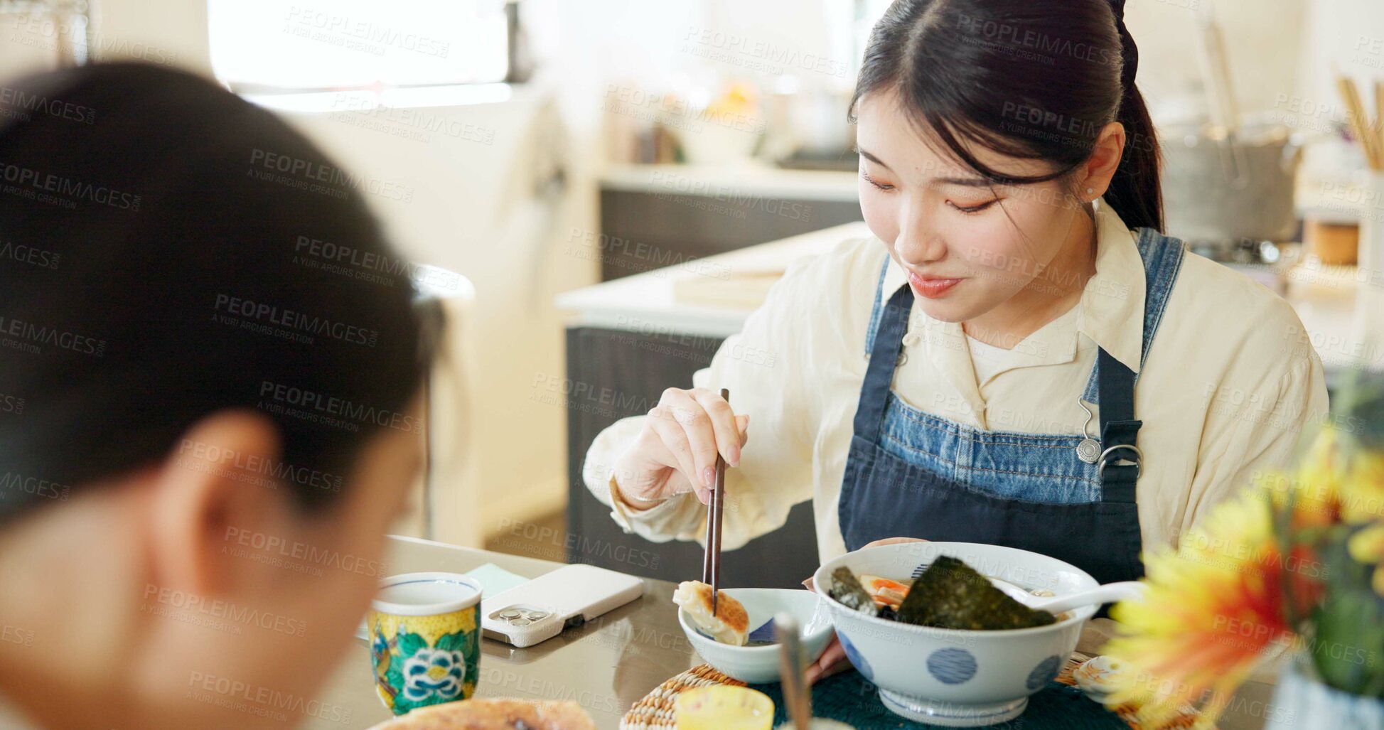 Buy stock photo Japanese woman, eating and lunch in restaurant, chopsticks and hungry with plate for nutrition. Girl, people and food for health, wellness and diet with choice at cafeteria, diner and brunch in Tokyo