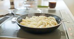 Cooking, kitchen and Japanese dumplings in pot on heat stove for lunch, meal preparation and dinner. Food, cuisine and traditional dish, ingredients and culinary for wellness, diet and nutrition