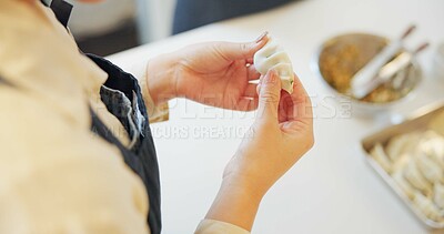 Buy stock photo Japan, dumplings and hand with table for dinner, kitchen and traditional meal in restaurant or cafe. Culture, gyozo and asian cuisine for nutrition, healthy diet and lunch with preparation or pastry 