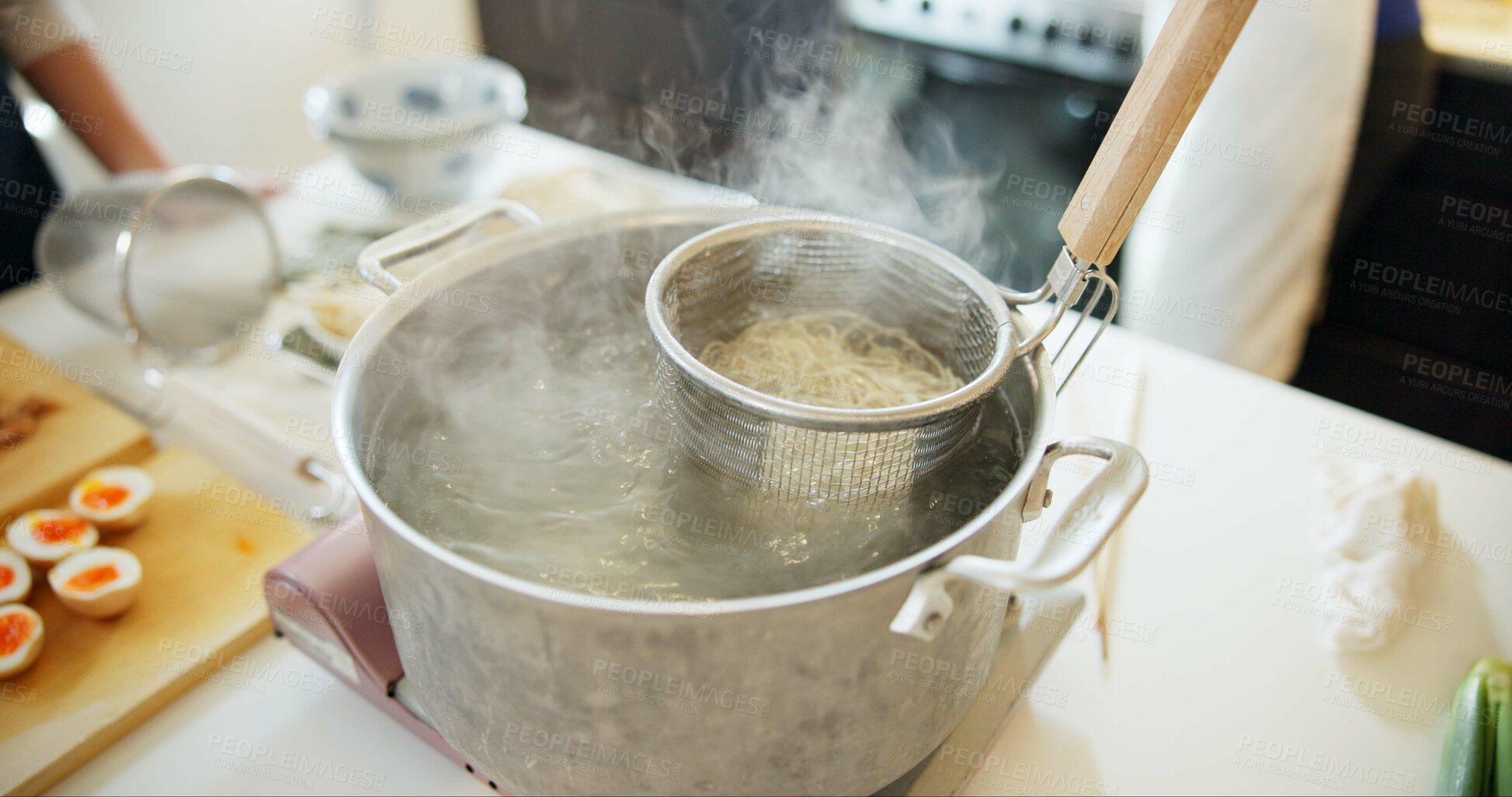 Buy stock photo Cooking, kitchen and Japanese noodles in pot in boiling water for lunch, meal preparation and dinner. Food, cuisine and traditional dish, ingredients and steam for wellness, diet and nutrition