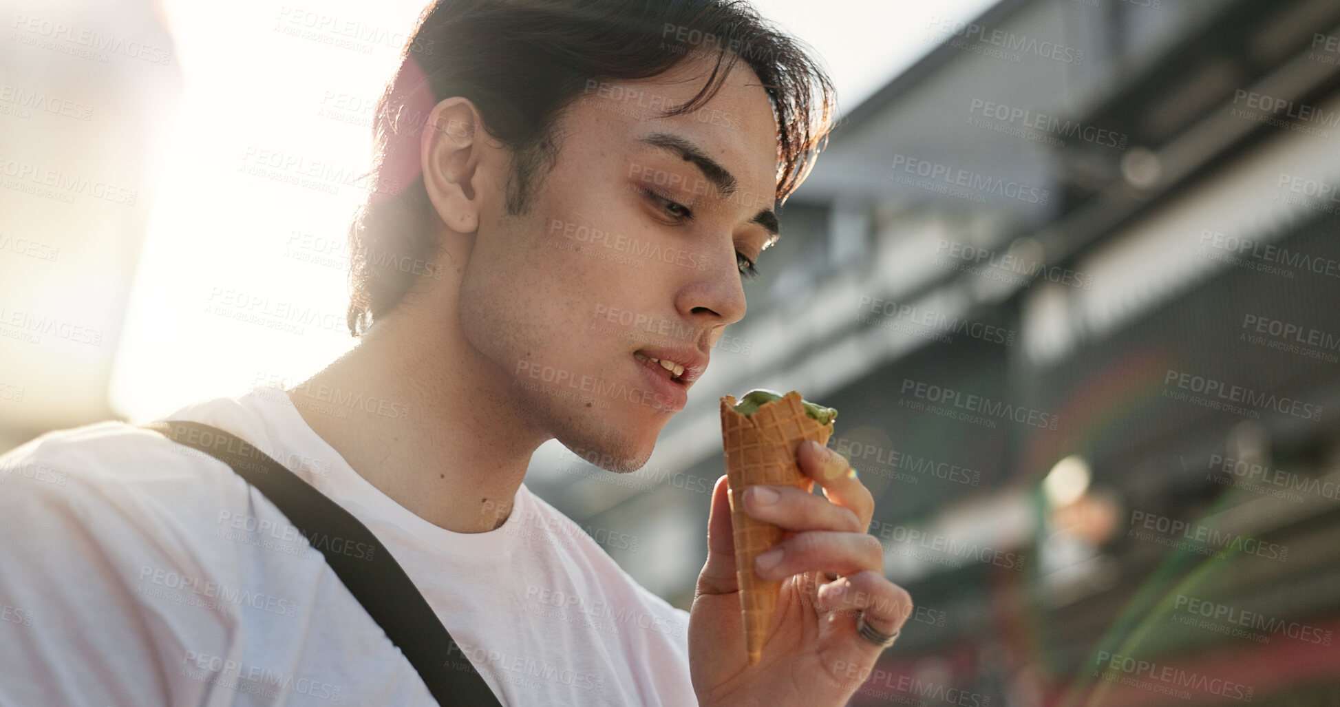 Buy stock photo Ice cream, eating and Japanese man in city on vacation, holiday and adventure in Yokohama town. Travel, weekend trip and person with dessert, sweet snack and cone in street for tourism destination