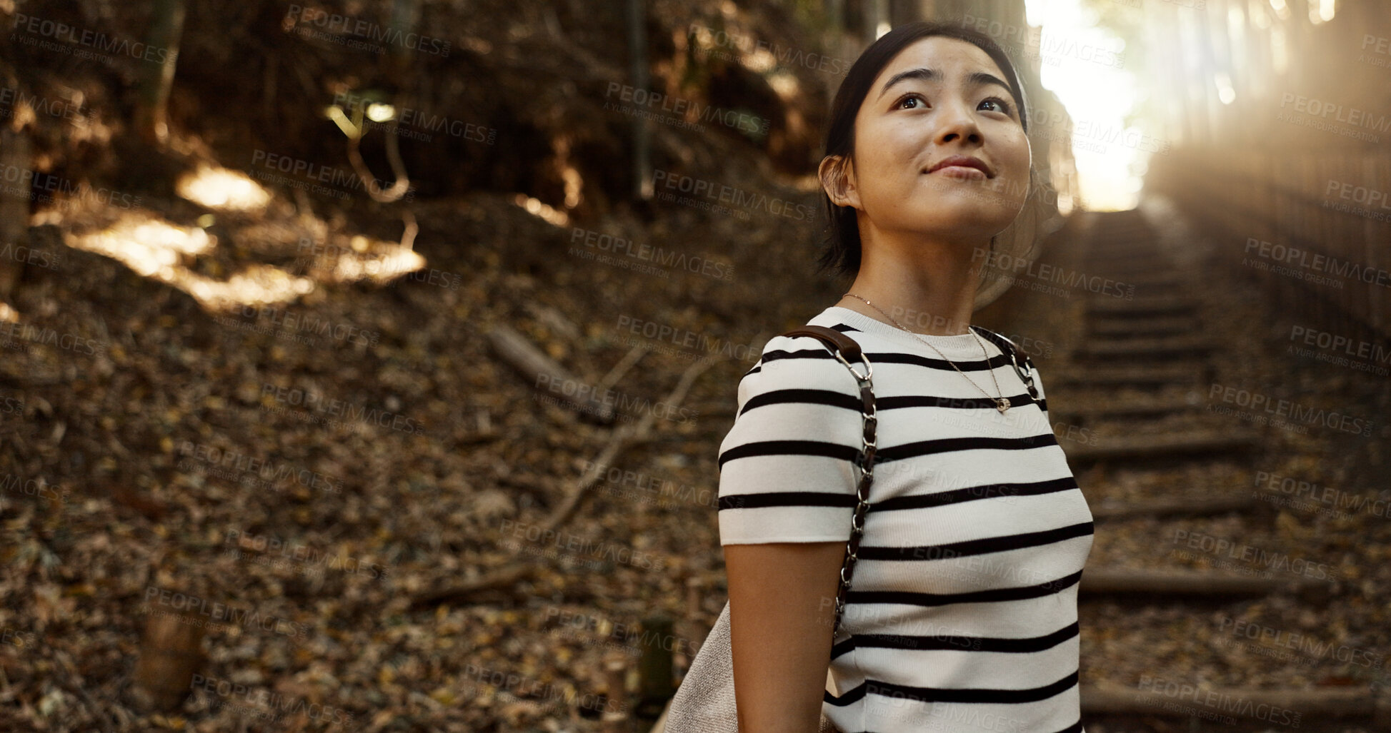 Buy stock photo Nature, travel and Japanese woman in park for adventure on holiday, vacation and morning in woods. Thinking, happy and person in forest, path and trail to explore, walking and freedom in Kyoto