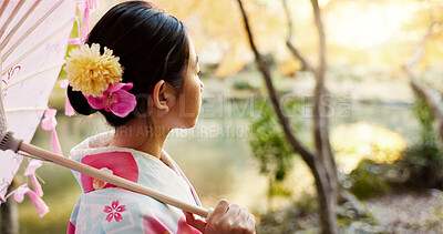 Buy stock photo Nature, traditional and Japanese woman in park for thinking, fresh air and relax with umbrella outdoors. Travel, culture and person in indigenous clothes, style and kimono on holiday, calm and peace