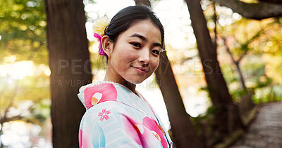 Buy stock photo Japanese woman, portrait and kimono in forest with smile, pride and traditional clothes for culture on walk. Girl, person and happy with indigenous fashion, style or outdoor by trees, woods or nature