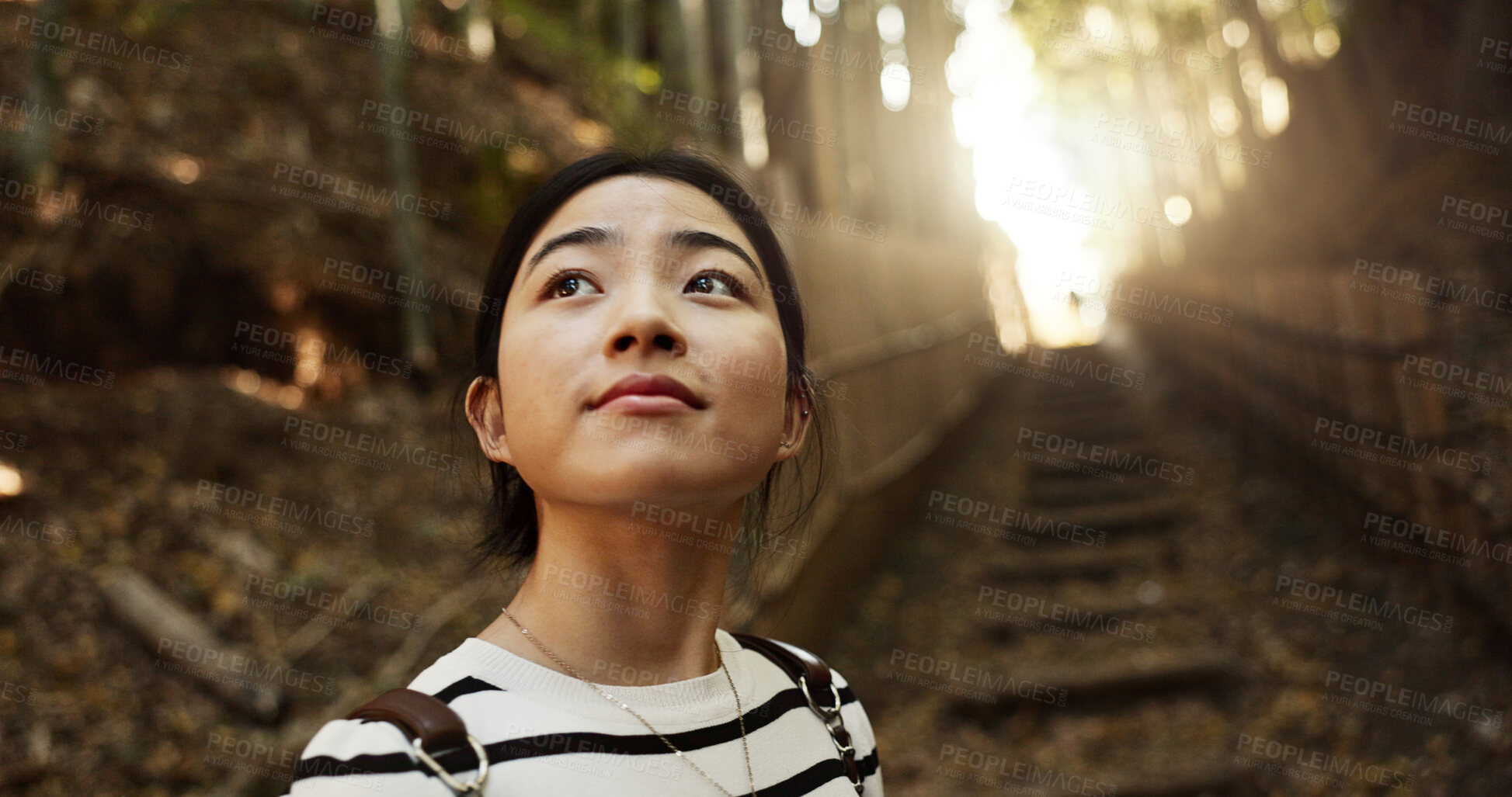 Buy stock photo Nature, thinking and Japanese woman in forest for adventure on holiday, vacation and morning. Travel, relaxing and person with natural plants in woods for freedom, walking and explore in Kyoto