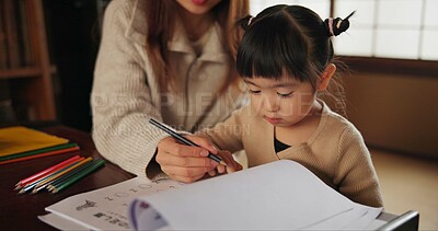 Buy stock photo Mother, child and drawing learning or pencil for home schooling lesson, Japanese or tutor. Female person, girl daughter and book paper in Tokyo or writing help for art studying, creative or project