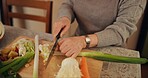 Cooking, vegetables and closeup of woman in kitchen cutting ingredients for meal, dinner or lunch. Food, diet and zoom of female person preparing organic supper for nutrition with produce at home.