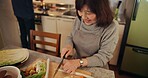 Cooking, smile and Japanese woman in kitchen cutting vegetables for meal, dinner or lunch. Happy, positive and senior female person preparing food for supper together with produce at modern home.