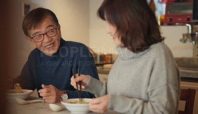 Buy stock photo Japanese couple, food and home with conversation, love and bonding together with happiness, romance and smile. Apartment, old man or senior woman with healthy meal, nutrition and cheerful with dinner