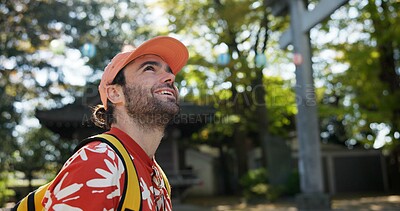 Buy stock photo Outdoor, thinking and man with a smile, travel and nature with sunshine, Japan and tourism. Person, park and guy with happiness, vacation and adventure with journey, getaway trip and exploration