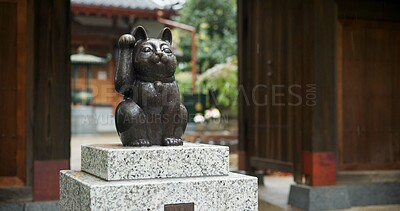 Buy stock photo Maneki neko, statue and Japanese or traditional temple at woods garden for respect, worship or spirituality. Sculpture, lucky cat and outdoor or traveling adventure in Tokyo, Gotokuji and fortune