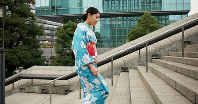 Buy stock photo Stairs, woman and walking with traditional clothes, travel and fresh air with wellness, healthy and peace. Japanese person, city and girl with culture, movement and thinking with student and steps