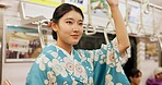 Woman, japan and train, kimono and travel with public transport, metro bullet in city. Person, journey or traditional clothes in motion blur on weekend or commute in tokyo and passenger on adventure